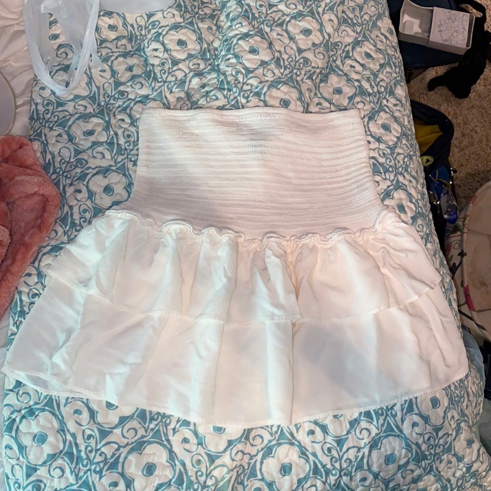 White ruffled mini skirt